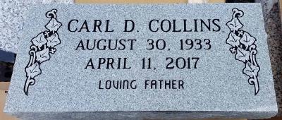 single gray granite headstone with ivy leaves design